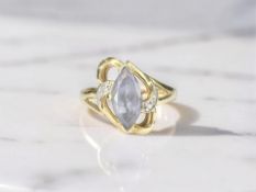 An 18ct gold diamond and marquise-cut tanzanite ring, size N CONDITION REPORT: 3.