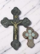 An embossed pewter and brass crucifix, height 51 cm,