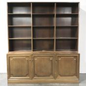 A continental mahogany open bookcase, fitted cupboards beneath, 165 cm x 39 cm x 186 cm.