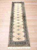 A Lahore Bokhara runner, Pakistan, 265 cm x 82 cm.