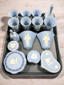 A group of Wedgwood blue Jasperware urns, wall pockets, trinket boxes, etc.