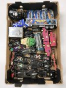 A group of plastic and die cast Batmobile models, Hot Wheels cars, and similar collectibles.