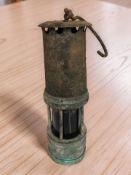 A 19th century miner's safety lamp.