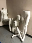 A group of female mannequins.