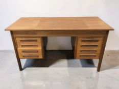 A 20th century Scandinavian teak twin pedestal writing desk, 136 cm x 60 cm x 73 cm.