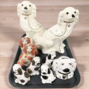A collection of 20th century Staffordshire dogs, money box, etc.