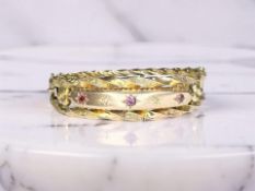 A late Victorian diamond, amethyst and garnet bangle,