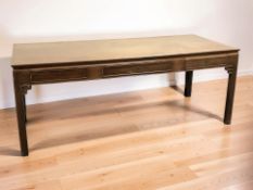 A 20th century Chinese hardwood rectangular library table, fitted three drawers,