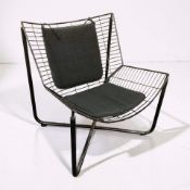 A Scandinavian wire metal lounge chair, width 62 cm.
