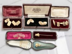 An Orientalist Movement stick pin with finial in the form of a Japanese man, length 6cm,