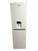 A Beko fridge freezer with water dispenser.