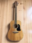An Aria acoustic guitar.
