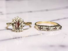 Two gold and silver garnet-set rings CONDITION REPORT: 4.
