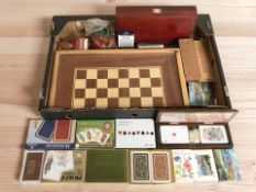 A collection of playing cards, dominoes, chess board, etc.