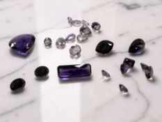 A group of synthetic/simulated amethysts, suitable for mounting in jewellery, largest 7.