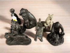 A group of metal and resin dog figures and groups, tallest 15 cm.