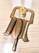 A treen string box and an oak mirror, with brushes.