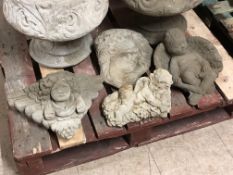 A group of five concrete garden ornaments