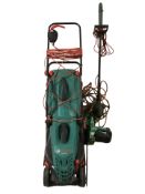 A Bosch electric lawnmower, a strimmer and a chainsaw.