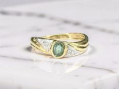 A diamond and demantoid garnet ring, stamped 750, size M CONDITION REPORT: 1.