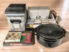 A Sharp hi-fi system, various CDs, Scrabble and draughts games, a crockpot.