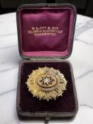 A Victorian split pearl and enamel brooch, set in unmarked yellow metal, width 4.5cm.