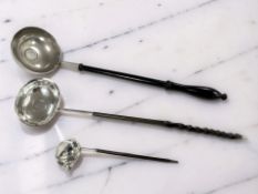 Two Georgian silver toddy ladles with horn handles, longest 34cm, plus a further base-metal example.