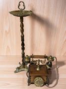 A beech and brass smoker's stand, height 67 cm, and a reproduction rotary telephone.