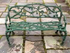 A painted cast iron naturalistic two seater garden bench, modelled as scrolling oak branches,