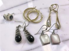 Five pairs of silver and gem-set earrings