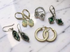 Five pairs of silver and gem-set earrings