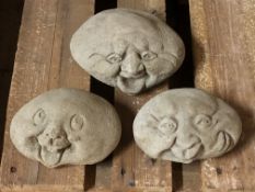 Three concrete happy face stones and twelve stepping stone feet