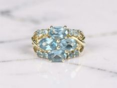 A 14ct gold blue topaz cluster ring, size N CONDITION REPORT: 3.
