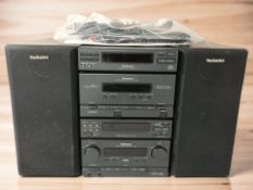 A Technics hi-fi system and speakers.