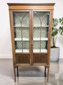 A late Victorian mahogany and satinwood inlaid display cabinet, 89 cm x 33 cm x 175 cm.