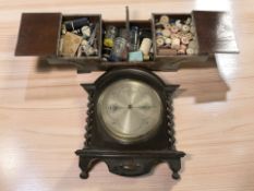 An oak concertina sewing box and contents, and a barley twist wall barometer with silvered dial,