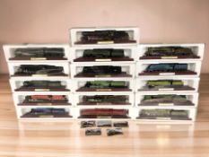 Sixteen die cast model locomotives on plinths.