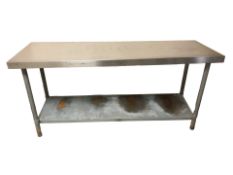 A stainless steel two tier catering table, length 180 cm.