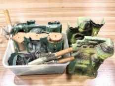 A collection of He Man model buildings and toy swords (one box)