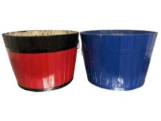 Two painted half barrel planters, diameter 56 cm.