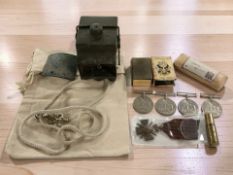 A group of militaria including four Second World War defence medals, a French 1914-1918 Star,