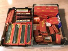 A collection of Hornby Tri-Ang OO gauge rolling stock and model railway building components.