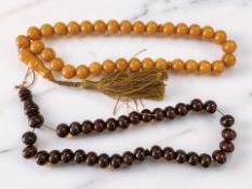 Two cherry and butterscotch-coloured bead necklaces
