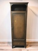 An early 20th century oak CWS Limited hall cupboard, 65 cm x 43 cm x 185 cm.