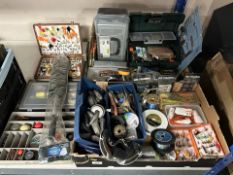 A collection of fishing equipment, flies, tools, lures, lead weights, etc.