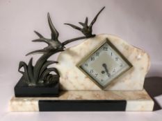 An Art Deco mantel clock, width 38 cm.