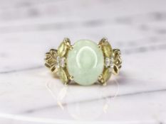A 9ct gold jade cabochon ring, size M CONDITION REPORT: 2.