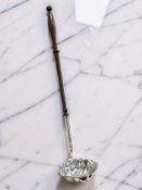 A silver toddy ladle with turned wooden handle, London 1969, length 37cm.