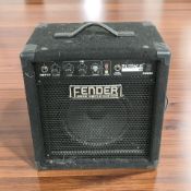 A Fender Rumble 15 amplifier, with lead.
