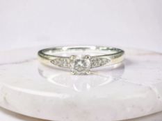 The Diamond Story : An 18ct white gold solitaire diamond ring, 0.